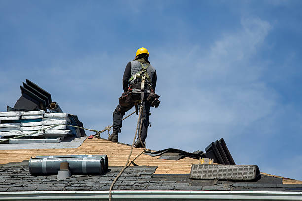 Professional Roofing technician working in Langlois, OR